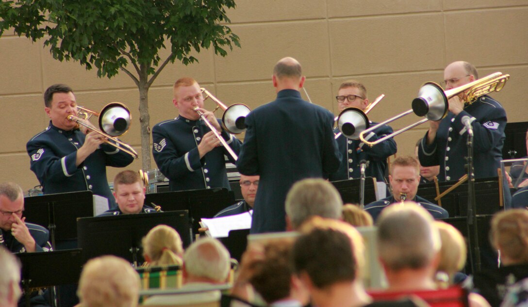 Instrumentalists with the Air National Guard Band of the Midwest perform for audiences during annual training at the Grundy County Courtyard Lawn, Morris, Ill., June 29, 2014. They performed jazz, rock and concert music for audiences in Illinois and Wisconsin as part of their community relations tour before a grand finale in Minnesota July 4. The annual concert series was the result of a year’s worth of training and practice, one that the band used to celebrate patriotism with communities across the Midwest. (Courtesy photo/Released)
