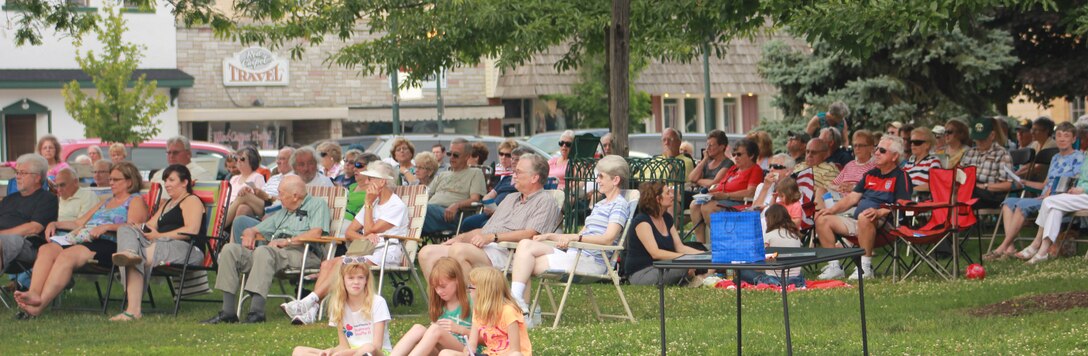 Audience members watch as the Air National Guard Band of the Midwest performs during annual training at the Grundy County Courtyard Lawn, Morris, Ill., June 29, 2014. They performed jazz, rock and concert music for audiences in Illinois and Wisconsin as part of their community relations tour before a grand finale in Minnesota July 4. The annual concert series was the result of a year’s worth of training and practice, one that the band used to celebrate patriotism with communities across the Midwest. (Courtesy photo/Released)