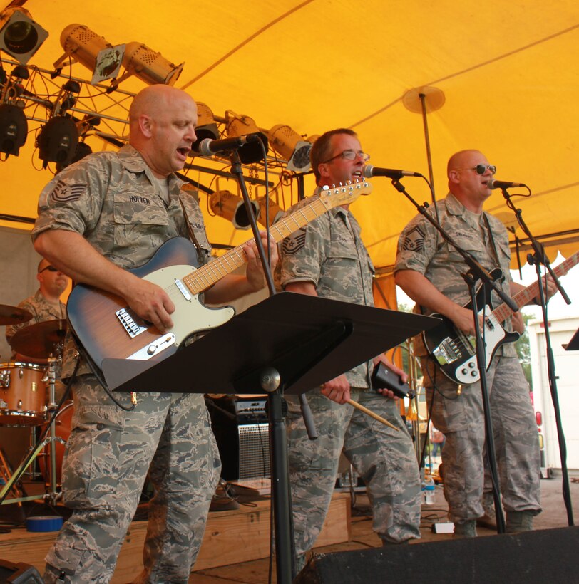 Instrumentalists with the Air National Guard Band of the Midwest perform for audiences during annual training in City Park Summer Fun Fest, Oglesby, Ill., June 28, 2014. They performed jazz, rock and concert music for audiences in Illinois and Wisconsin as part of their community relations tour before a grand finale in Minnesota July 4. The annual concert series was the result of a year’s worth of training and practice, one that the band used to celebrate patriotism with communities across the Midwest. (Courtesy photo/Released)