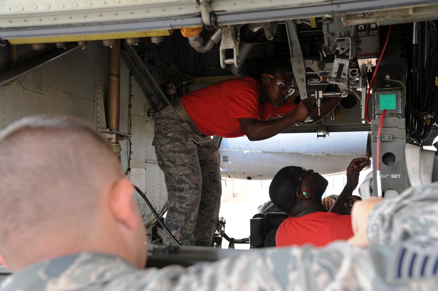Staff Sgt. Jarrett Dodge, 2nd Aircraft Maintenance Squadron evaluator, evaluates the 96th Aircraft Maintenance Unit load crew during a weapons load competition on Barksdale Air Force Base, La., Sept. 19, 2014. The competition consisted of a uniform inspection, system knowledge test and the weapon load process. (U.S. Air Force photo/Senior Airman Jannelle Dickey) 