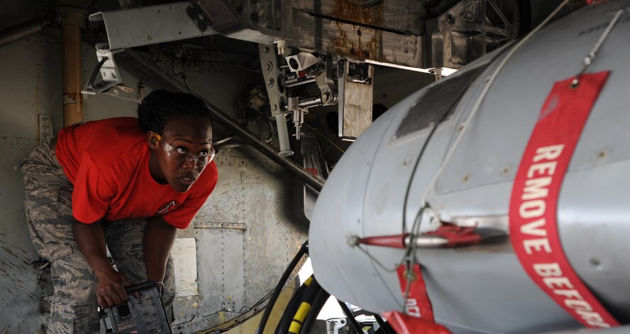 Senior Airman Breyana Anderson, 96th Aircraft Maintenance Unit weapons loader, analyzes the position of a common strategic rotary launcher in the bomb bay of a B-52H Stratofortress during a weapons load competition on Barksdale Air Force Base, La., Sept. 19, 2014. The competition allows load crews to increase morale, teamwork and readiness. (U.S. Air Force photo/Senior Airman Jannelle Dickey)