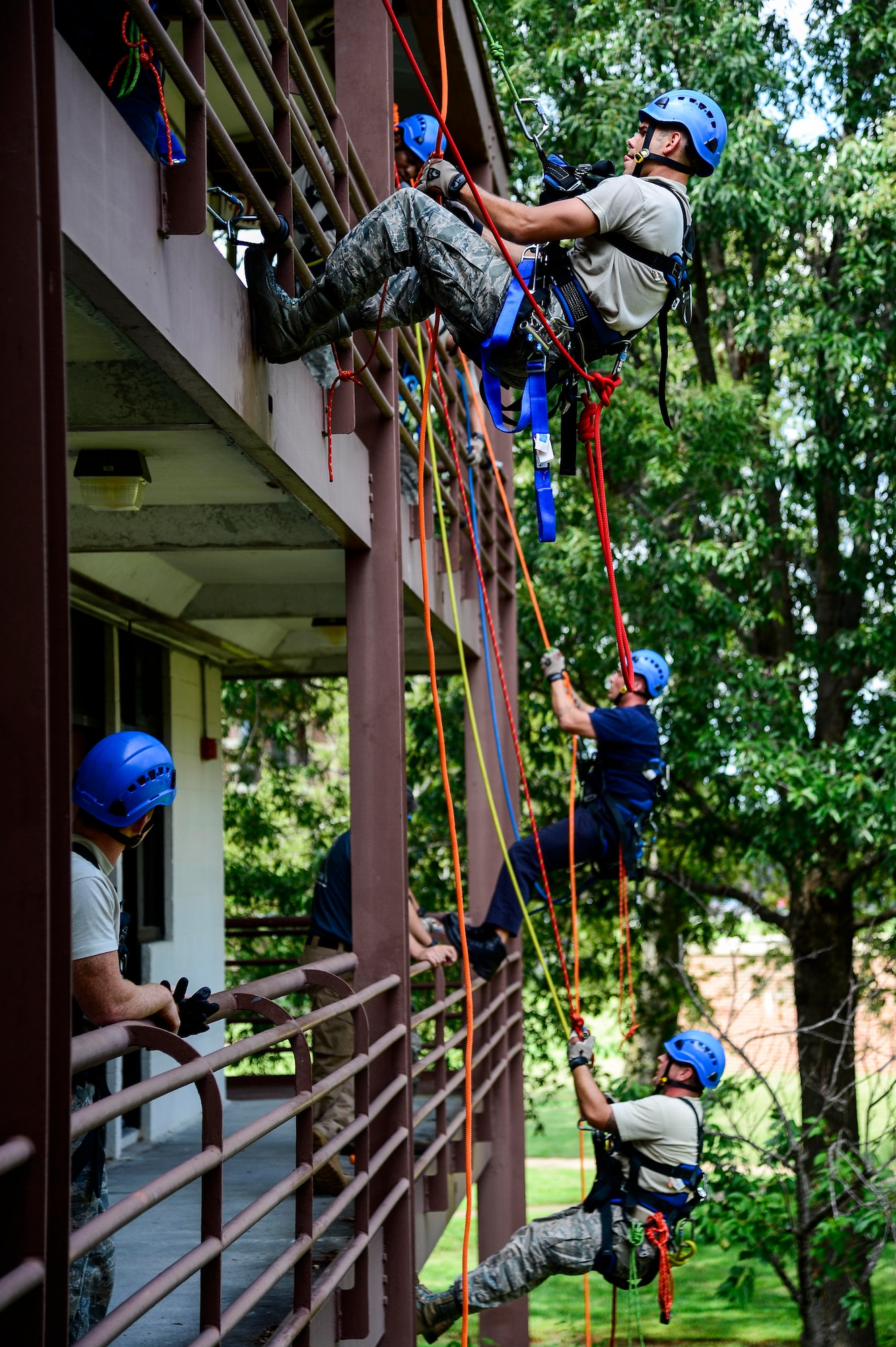 U.S. Air Force firefighters from across the nation perform high angle rescue training at Langley Air Force Base, Va., Sept. 17, 2014. The training is designed to teach the fundamentals in establishing anchors and knots, rope rescues, suspended victims in basket rescues, high-line rescues and confined space rescues. (U.S. Air Force photo by Senior Airman Kayla Newman/Released)