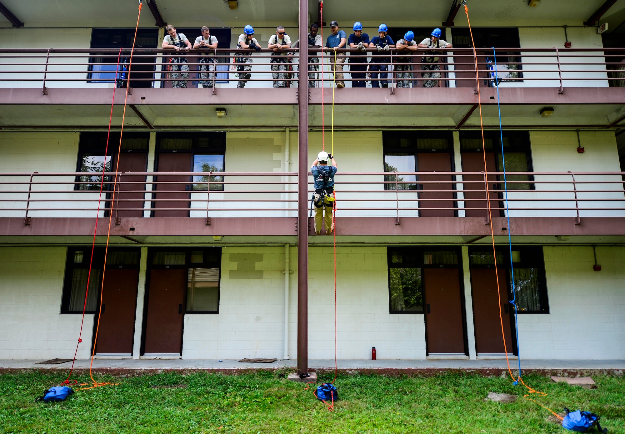 U.S. Air Force firefighters from across the nation attend a 15-day training course at Langley Air Force Base, Va., Sept. 17, 2014. The training, led by Louis F. Garland Department of Defense Fire Academy instructors, teaches firefighters how to perform high angle rescues which includes passing the knot in a system obstacle, ascending up the rope, conducting a break bar system, descending and picking up victims. (U.S. Air Force photo by Senior Airman Kayla Newman/Released)