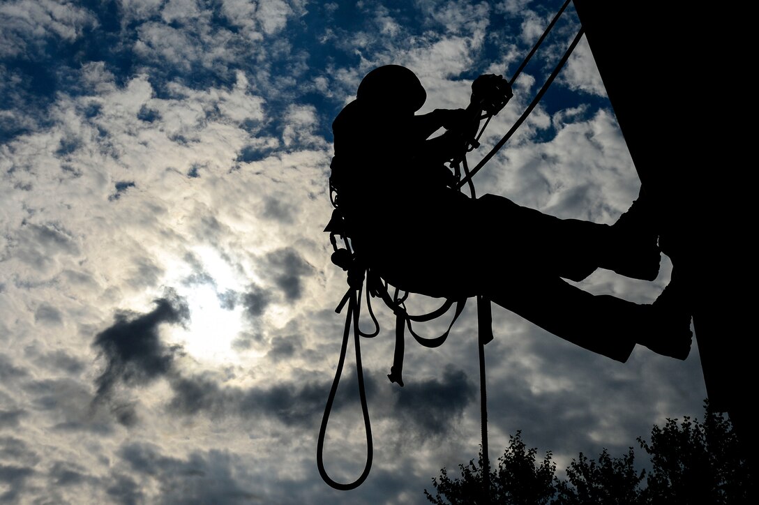 A U.S. Air Force firefighter participates in high angle rescue training at Langley Air Force Base, Va., Sept. 17, 2014. The training was part of a 15 day course, led by two instructors from the Louis F. Garland Department of Defense Fire Academy. (U.S. Air Force photo by Senior Airman Kayla Newman/Released)