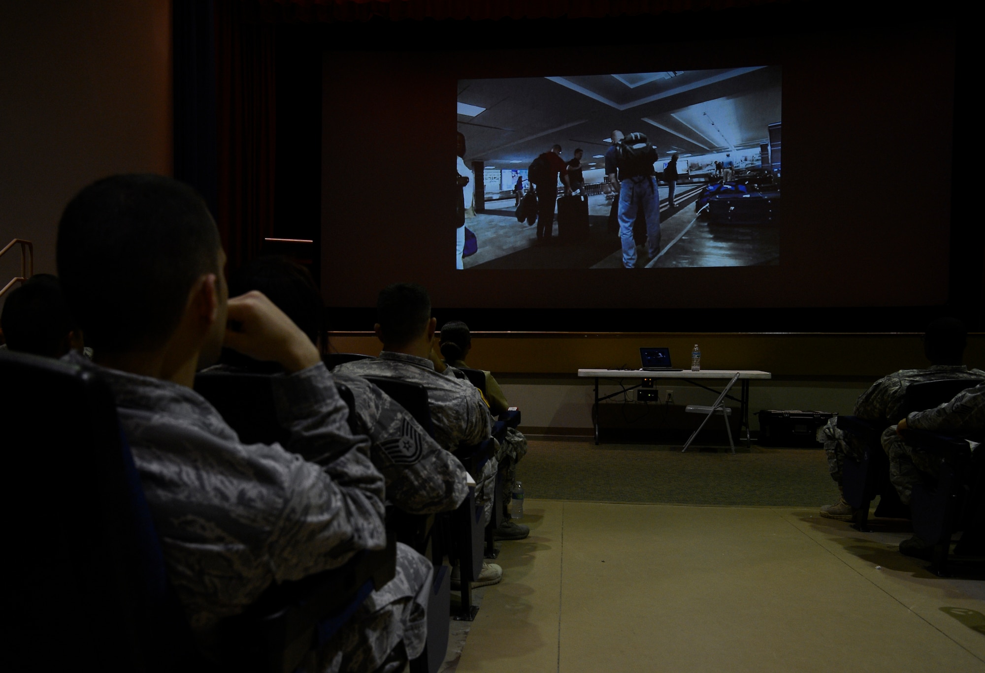 Members of Team MacDill attend a White House Communications Agency briefing at the base theater on MacDill Air Force Base, Fla., Sept. 23, 2014. The WHCA hosted a briefing to recruit service members for positions within their agency. (U.S. Air Force photo by Senior Airman Shandresha Mitchell/Released)
