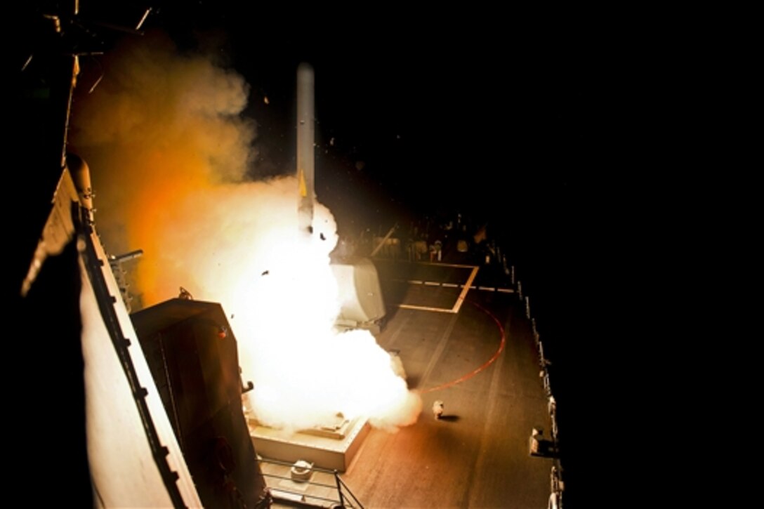 The guided-missile destroyer USS Arleigh Burke launches a Tomahawk cruise missile in the Red Sea, Sept. 23, 2014, to conduct strikes against targets in the Islamic State of Iraq and the Levant, or ISIL.