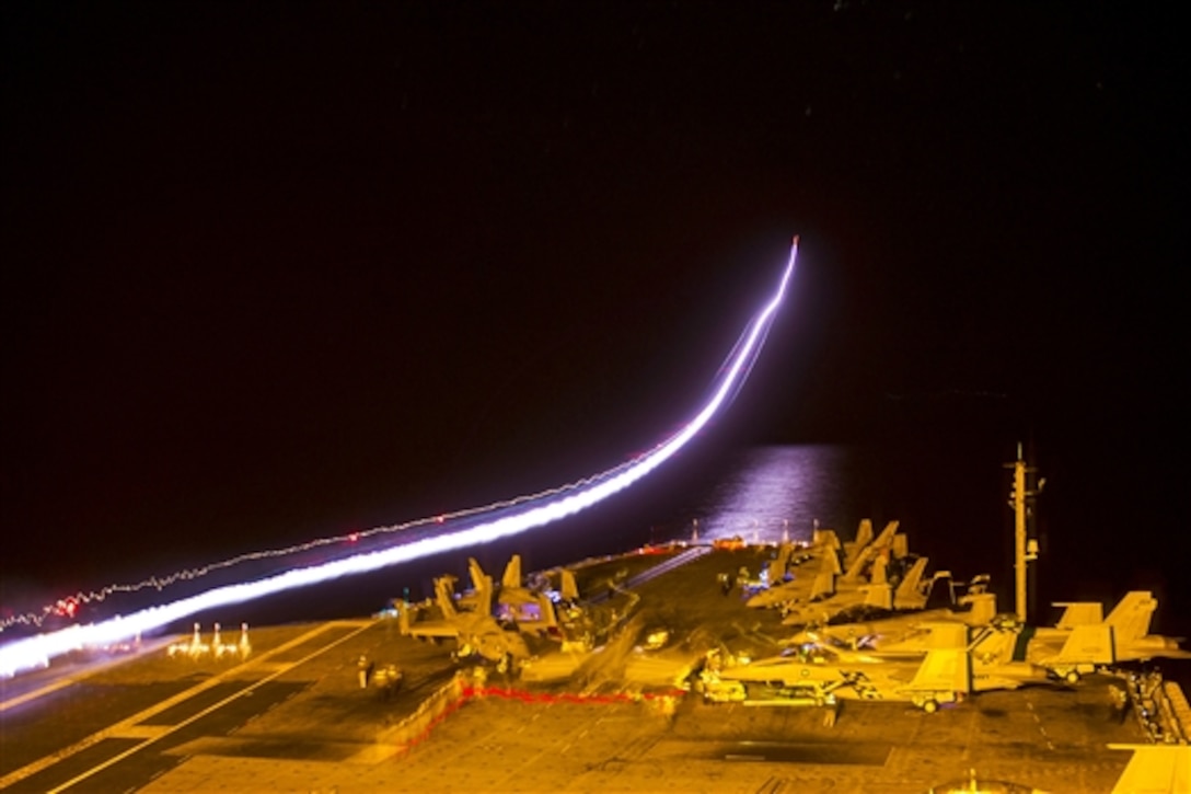 An EA-18G Growler takes off from the flight deck of the aircraft carrier USS George Washington in the Pacific Ocean, Sept. 20, 2014. The George Washington is participating in Valiant Shield, U.S. exercise integrating an estimated 18,000 Navy, Air Force, Army and Marine Corps personnel, more than 200 aircraft and 19 surface ships. The Growler is assigned to Electronic Attack Squadron 141. 
