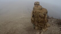 Lance Corporal Grant Baker, a rifleman with Company L, 3rd Battalion, 1st Marine Regiment, hikes to his company objective during the Marine Corps Combat Readiness Evaluation aboard Marine Corps Base Camp Pendleton, Calif., Sept. 23, 2014. The Marines were conducting operations to assess their operational capabilities in a deployed environment. The Marines spent five days hiking, providing security and setting defensive postures.