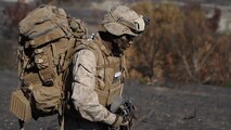 A rifleman with Company L, 3rd Battalion, 1st Marine Regiment, hikes to his company objective during the Marine Corps Combat Readiness Evaluation aboard Marine Corps Base Camp Pendleton, Calif., Sept. 23, 2014. The Marines were conducting operations to assess their operational capabilities in a deployed environment. The Marines spent five days hiking, providing security and setting defensive postures.