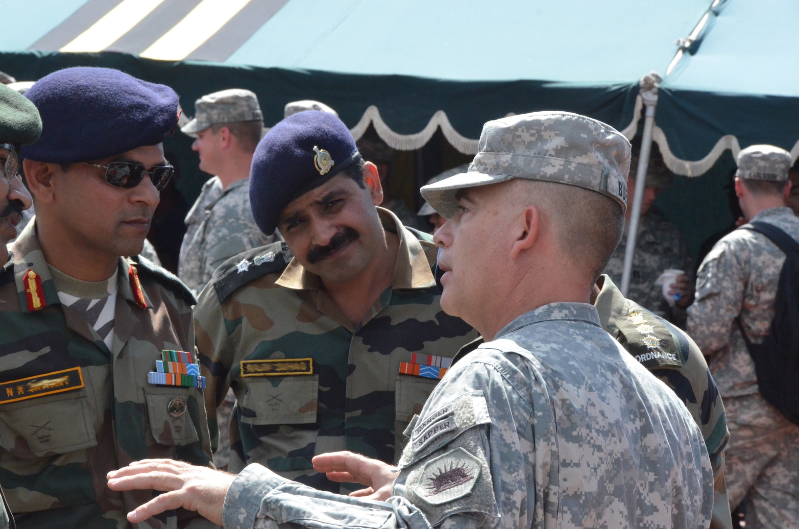 Col. Steven Buethe speaks with Indian Army leadership during a social event following the opening ceremony for Yudh Abhyas 2014 at Chaubattia Cantonment, India, on Sept. 17.