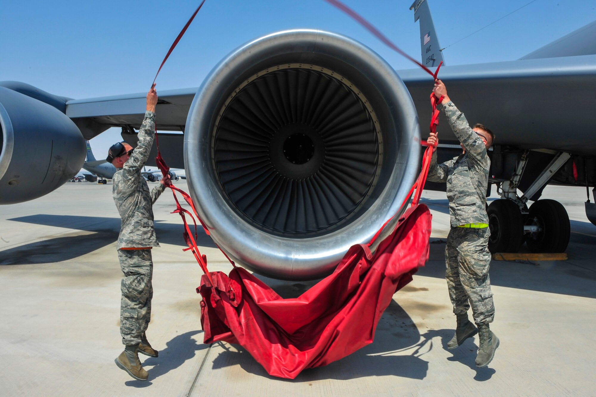U.S. Air Force Senior Master Sgt. Brian Dillon 340th Expeditionary Air Refueling Squadron boom operator, looks over the controls of the boom in a KC-135 Stratotanker at Al Udeid Air Base, Qatar, Sept. 20, 2014. Dillon is deployed from the 190th Air Refueling Wing in Topeka, Kansas. His hometown is Niagara Falls, New York. (U.S. Air Force photo by Senior Airman Colin Cates)  