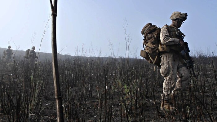 A rifleman with Company L, 3rd Battalion, 1st Marine Regiment, hikes to his company objective during the Marine Corps Combat Readiness Evaluation aboard Marine Corps Base Camp Pendleton, California, Sept. 23, 2014. The MCCRE is designed to be a final evaluation to ensure the Marines are prepared to be deployed. The battalion is slated to deploy as the ground combat element of the 15th Marine Expeditionary Unit next year.