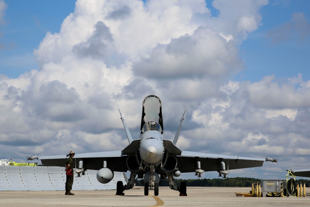 Marines with Marine Fighter Attack Squadron 251 prepare jets to take off for a group sail exercise, Sept. 18. The exercise promotoes the unity and synergy of Carrier Strike Group 12, which has not worked together since 2012, in preparation of an upcoming deployment.
