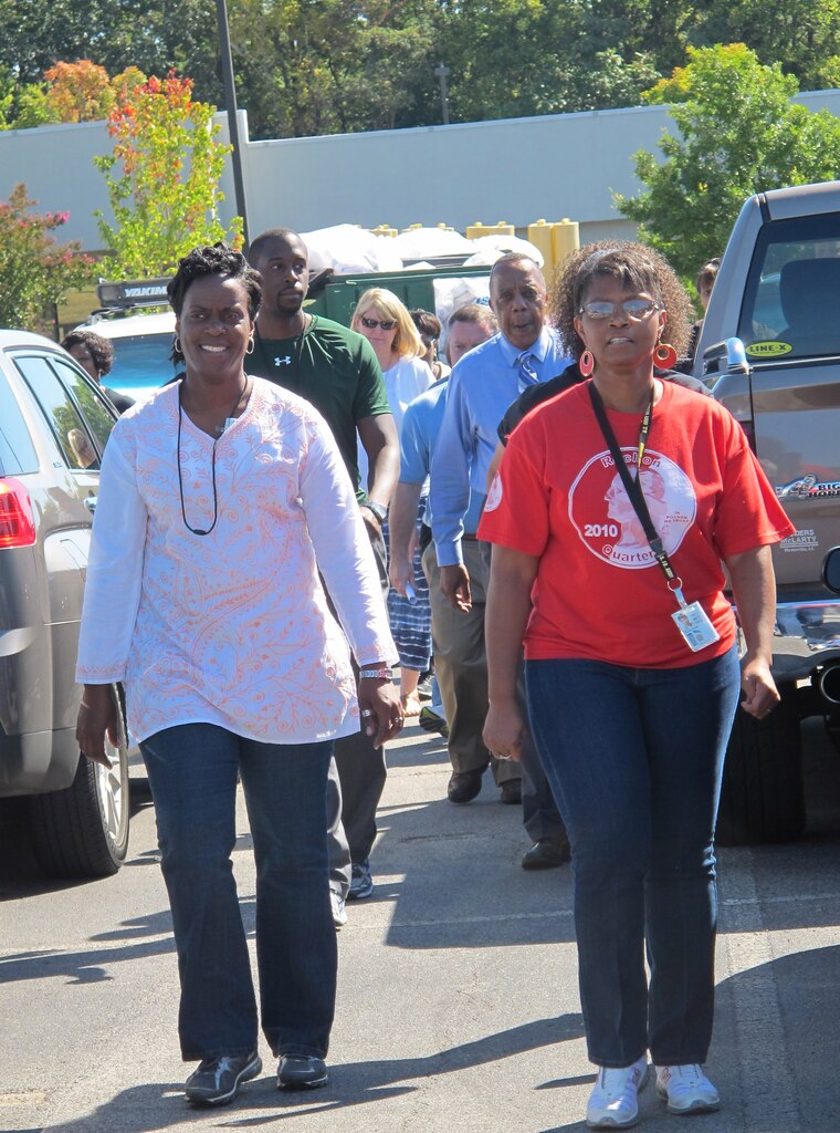 Carla McNeal, left, leads Huntsville Center employees in a stress relief walk Sept. 24.

