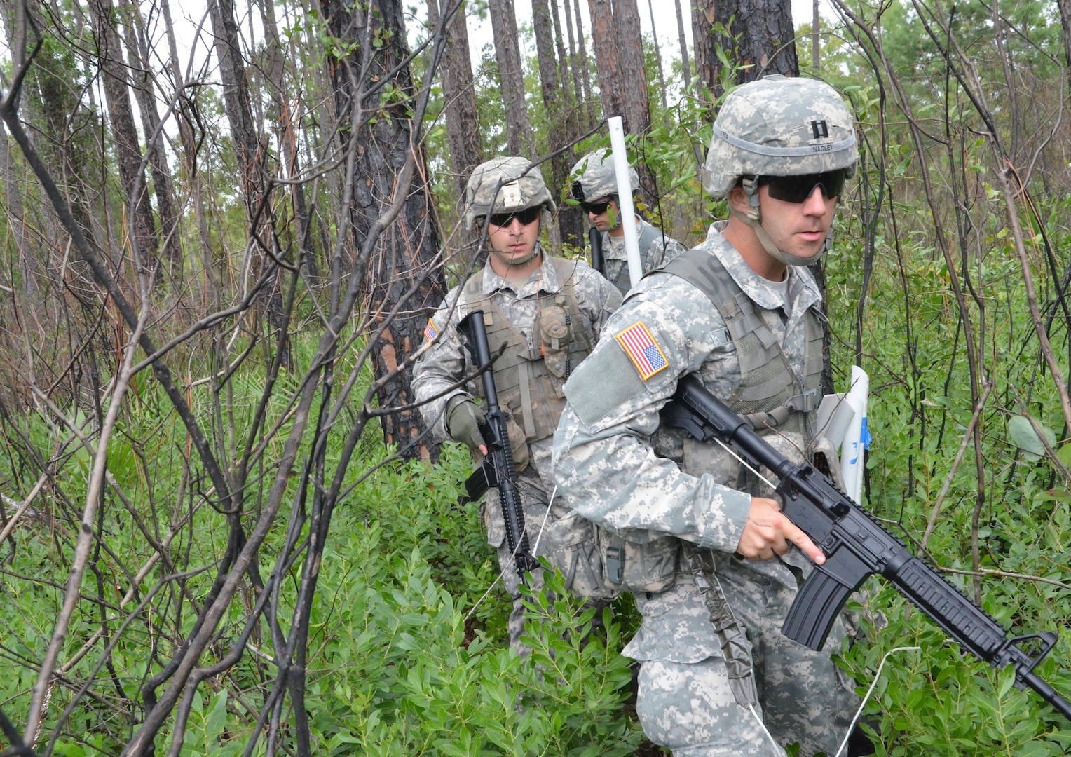 Capt. Raymond Nagley, right, of the Florida Army National Guard's 254th Transportation Battalion, takes part in a recon mission as part of a field training exercise during the Pathfinder Course at Camp Blanding Joint Training Center, Fla., Sept. 24, 2014. 