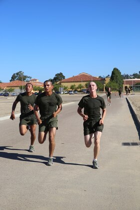 Recruits of Fox Company, 2nd Recruit Training Battalion, sprint to the finish of a three-mile run during their final physical fitness test at Marine Corps Recruit Depot San Diego, Calif., Sept. 25. The final physical fitness test includes a timed three-mile run, a maximum set of pull-ups and timed maximum set of crunches. 