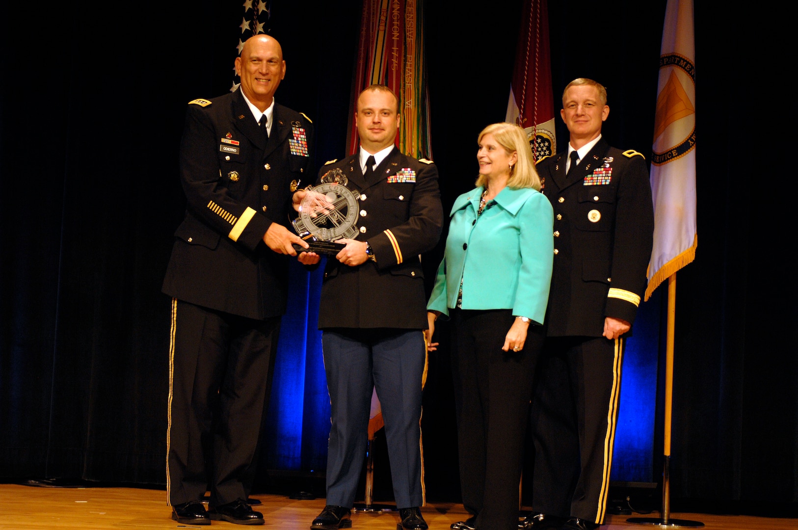 Michigan National Guard, Greenville-based 1073rd Support Maintenance Company Soldier, Chief Warrant Officer 2 Joey North, poses with Chief of Staff of the Army, Gen. Raymond Odierno, Acting Deputy Chief of Staff, G4, Kathleen Miller, and Army Chief of Ordnance Brig. Gen. Jack Haley after receiving the 1073rd SMC’s Army Award for Maintenance Excellence and the "The Best of the Best" awards. The award was given in recognition of the 1073rd SMC’s exceptional accomplishments within the Medium Military Table of Organization and Equipment category. 