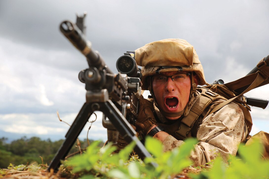 SCHOFIELD BARRACKS - A Marine with Golf Company, 2nd Battalion, 3rd Marine Regiment recites a practical phrase used to simulate the time it takes to send a burst of live fire at KR-5 live-fire range aboard Schofield Barracks, Sept. 19, 2014 as part of the Island Viper exercise. The exercise is meant to prepare Marines for real-world combat. (U.S. Marine Corps photo by Pfc. Harley Thomas)