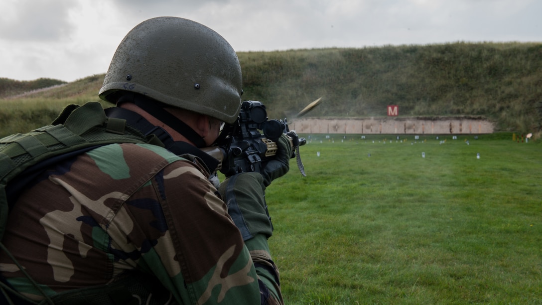 A marine from the Netherlands Marine Corps, fires a round down range during the Royal Marine Operational Shooting Competition at Altcar Ranges near Hightown, England, Sept. 16, 2014. The competitors at the contest represented the U.S., U.K., France and the Netherlands. (U.S. Marine Corps photo by Cpl. Cameron Storm/Released)
