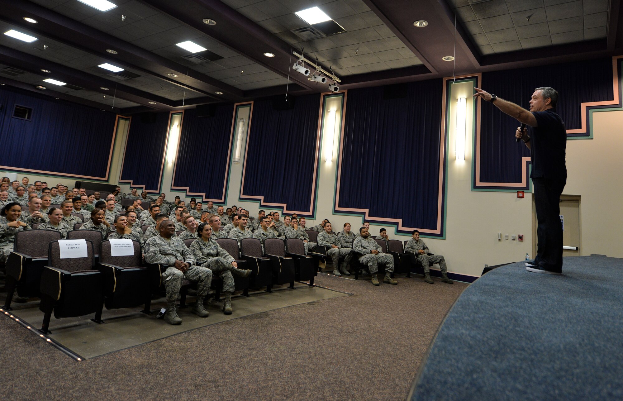 Air Commandos attend resiliency training at King Auditorium, Hurlburt Field, Fla., Sept. 24, 2014. Comedian Bernie McGrenahan spoke to Airmen about the importance of resiliency in a humor filled presentation. (U.S. Air Force photo/Senior Airman Christopher Callaway)  