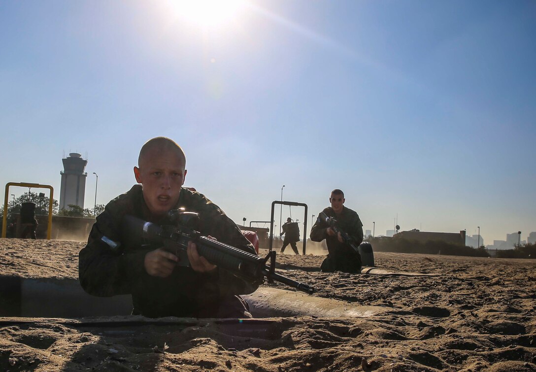 Recruits of Mike Company, 3rd Recruit Training Battalion, take aim on their next target during the bayonet assault course at Marine Corps Recruit San Diego, California, Sept. 24, 2014.  The technique was one of many taught to recruits in order to prepare them for a situation without ammunition.