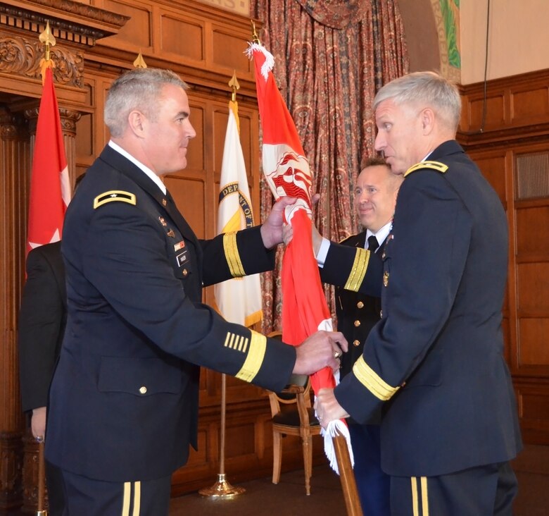 Maj. Gen. Richard L. Stevens, USACE Deputy Commanding General, passes the colors to Brig. Gen. Richard G. Kaiser, LRD Commanding General, during the LRD Assumption of Command ceremony on September 26, 2014 in Cincinnati, Ohio.