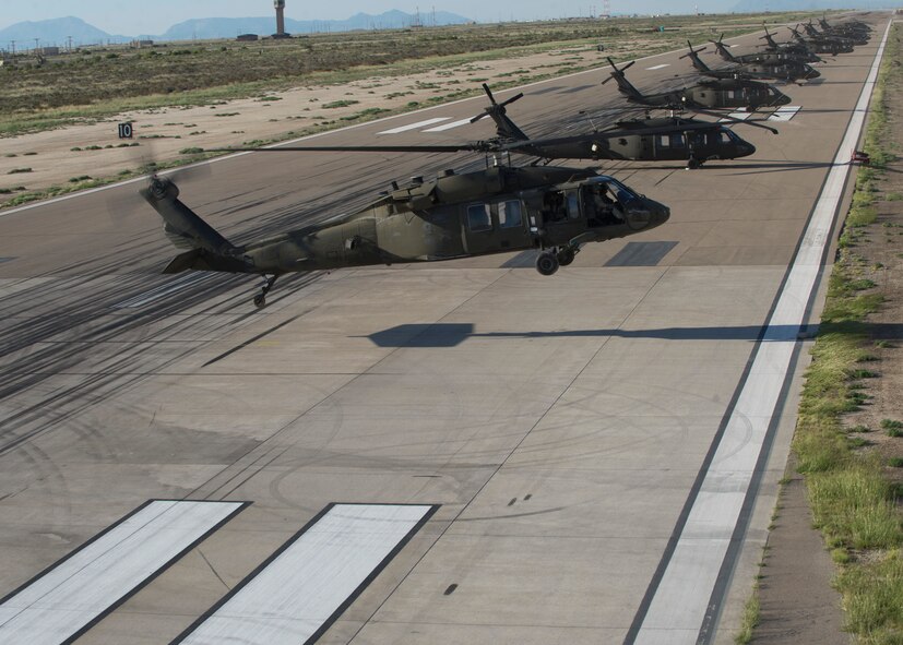 A U.S. Army UH-60M Black Hawk Helicopter takes off during a training exercise at Holloman Air Force Base, N.M, 25 Sept. Soldiers from the 101st Airborne Division use the Holloman and White Sands Missile Range training ranges to conduct a Hostile Environment Medical Training Course, designed specifically for Close Protection Operations during deployments to high threat regions throughout the world. (U.S. Air Force photo by Airman 1st Class Chase Cannon/ Released)