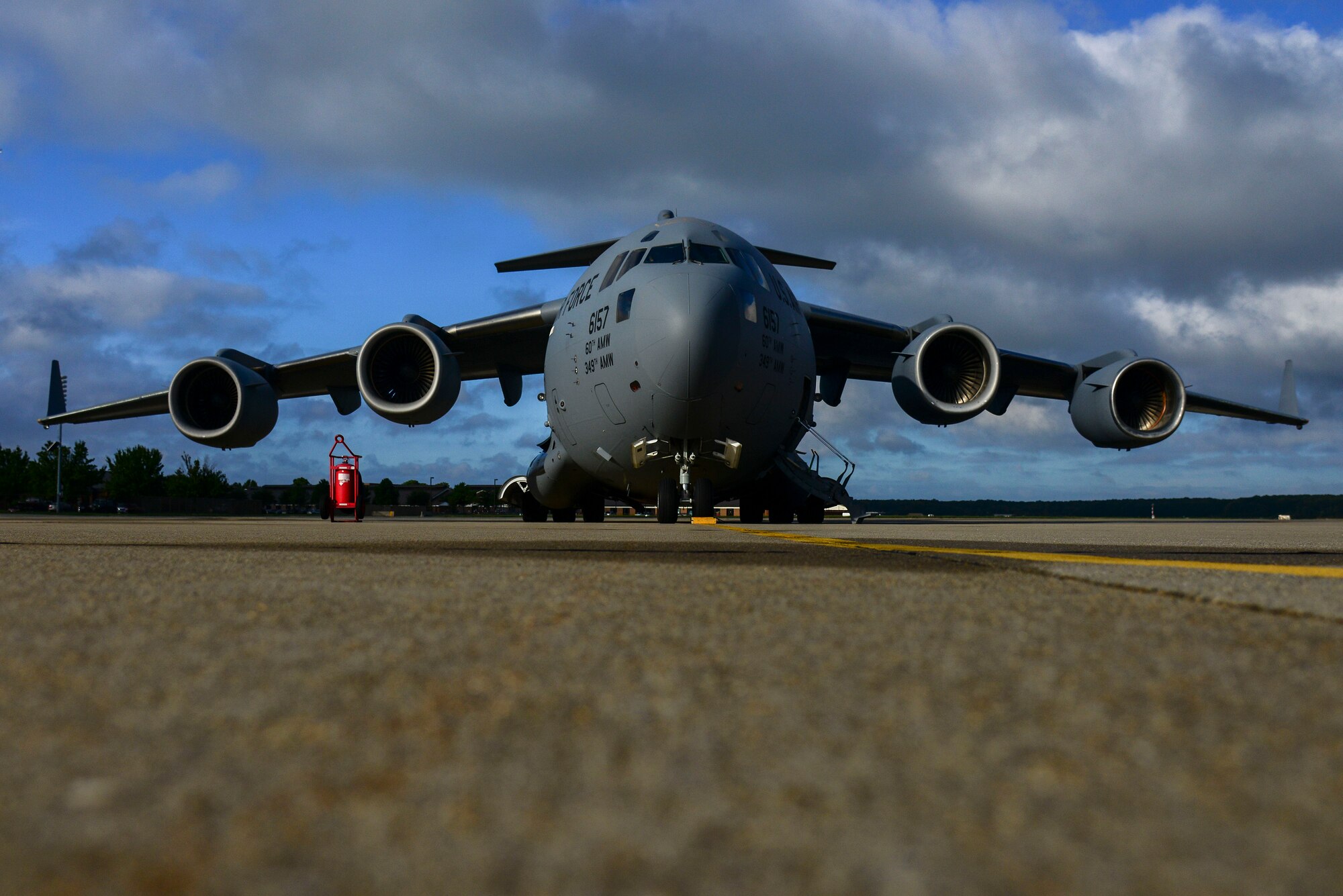 A C-17 Globemaster carrying personnel from the 633rd Medical Group prepares for departure at Langley Air Force Base, Va., Sept. 26. The 633rd MDG mission during their deployment to West Africa is to deliver and build the Air Force’s Expeditionary Medical Support System, a modular medical treatment platform and train healthcare workers in its operation. Langley Airmen will not be involved in treatment of patients exposed to the virus. (U.S. Air Force photo by Senior Airman Kayla Newman/Released)