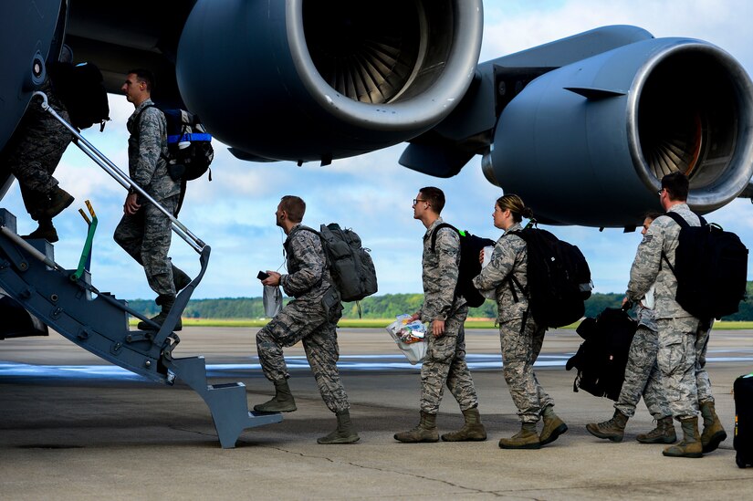 U.S. Air Force Airmen assigned to the 633rd Medical Group load onto a C-17 Globemaster at Langley Air Force Base, Va., Sept. 26, 2014. The 633 MDG packaged and delivered a modular medical treatment center, as part of a government-wide effort to support humanitarian relief operations in Ebola-stricken African nations. Langley Airmen will not be involved in treatment of patients exposed to the Ebola virus. (U.S. Air Force photo by Senior Airman Kayla Newman/Released)