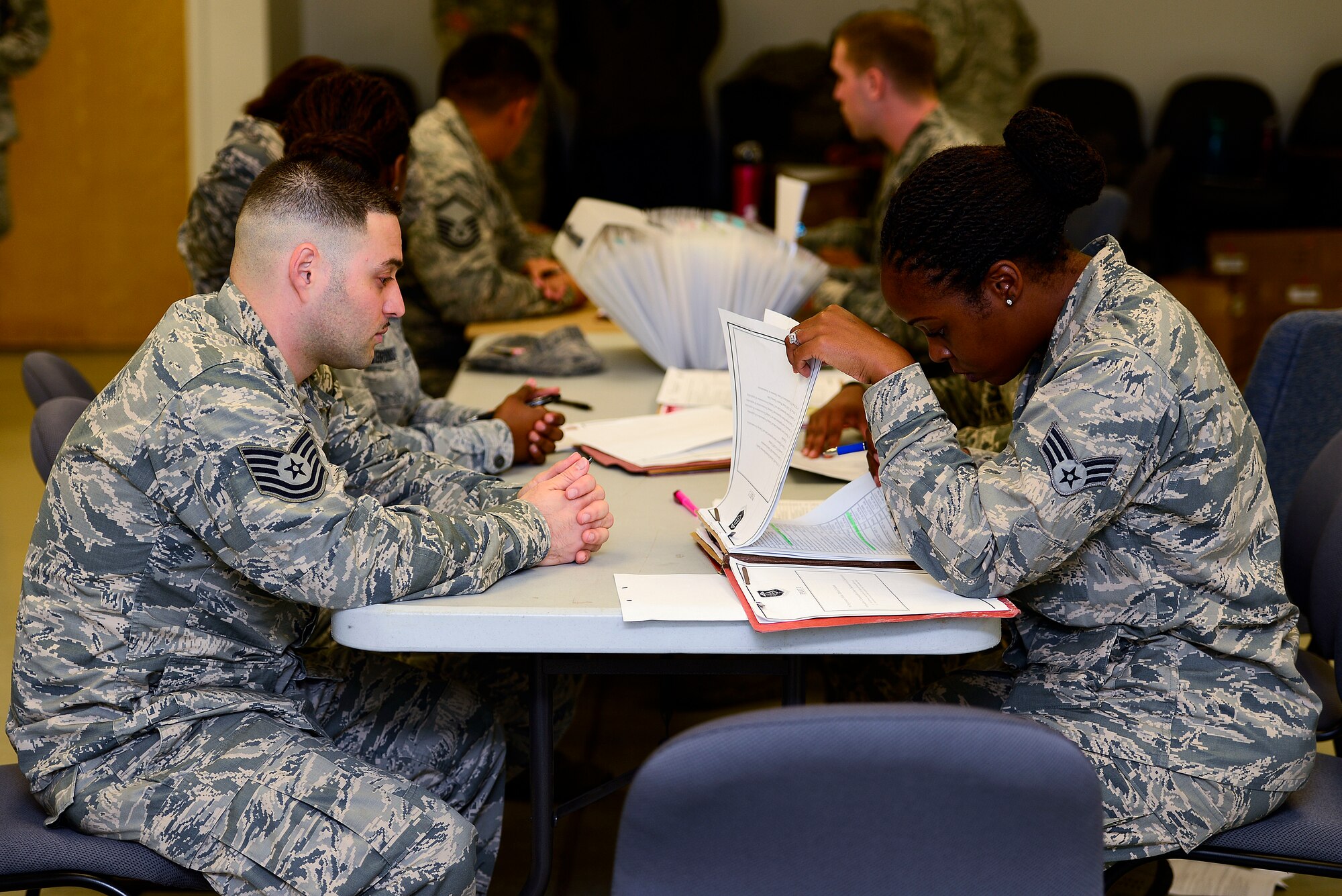 U.S. Air Force Airmen receive pre-deployment screenings at Langley Air Force Base, Va., Sept. 24, 2014. Airmen assigned to the 633rd Medical Group deployed in support of Operation United Assistance, which is the designation for Ebola Relief missions. (U.S. Air Force photo by Senior Airman Kayla Newman/Released)