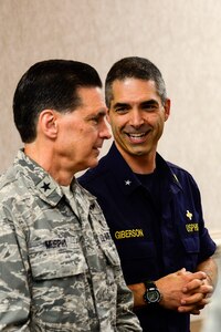 U.S. Public Health Service Rear Adm. Scott Giberson, U.S. Public Health Services acting deputy surgeon general, meets with U.S. Air Force Brig. Gen. Sean Lee Murphy, Air Combat Command surgeon general, during a briefing at Langley Air Force Base, Va., Sept. 22, 2014. Giberson and other members of the USPHS visited Langley to tour the Air Force’s Expeditionary Medical Support System. (U.S. Air Force photo by Senior Airman Kayla Newman/Released)