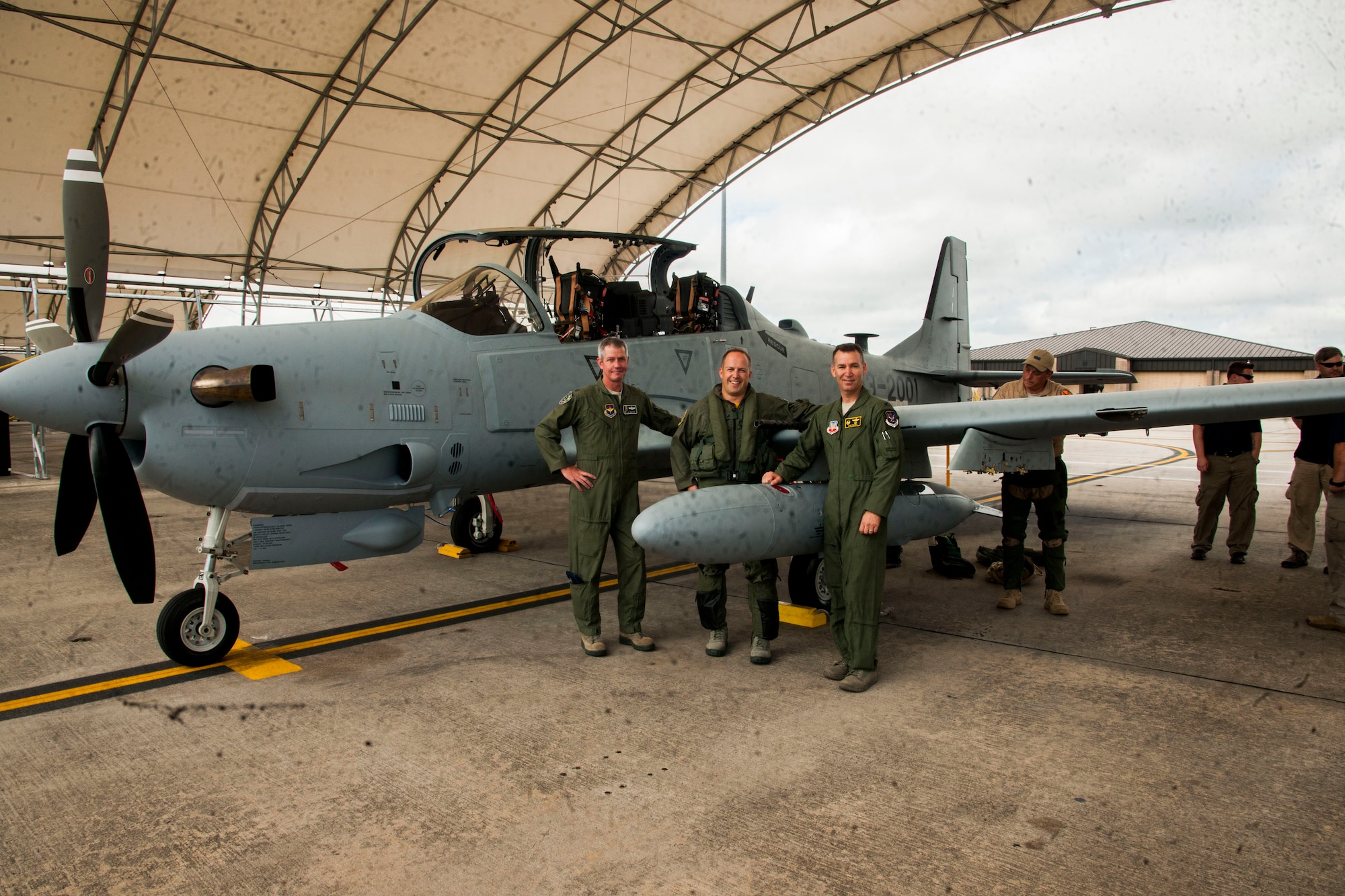 Col. James Boster, 14th Operations Group Commander, poses for a photo with Lt. Col. Jeffrey Hogan, Afghan A-29 Light Air Support training unit commander, and Col. Chad Franks, 23rd Wing Commander after the arrival of the first A-29 Super Tucano Sept. 26 at Moody Air Force Base, Georgia. The A-29 training unit at Moody is currently Detachment 1 of the 14th Operations Group, 14th Flying Training Wing headquartered at Columbus AFB, Miss. The Afghan A-29 Light Air Support training mission will begin at Moody in February 2015. The A-29 will provide offensive and defensive aerial fires capability and reconnaissance and surveillance capability within Afghanistan. (U.S. Air Force photo/Airman 1st Class Dillian Bamman) 