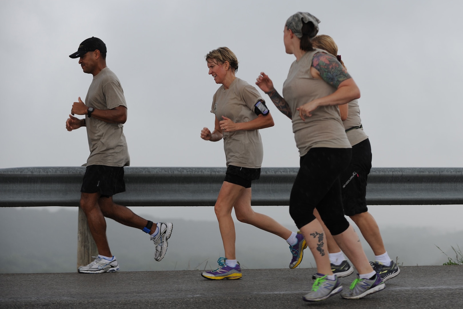 Rambler 120 participants run in the rain in the 6 mile run portion of the Rambler 120 after completing 22 miles on bikes Sept. 20 at Canyon Lake, Texas. (U.S. Air Force photo by Senior Airman Krystal Jeffers/Released)