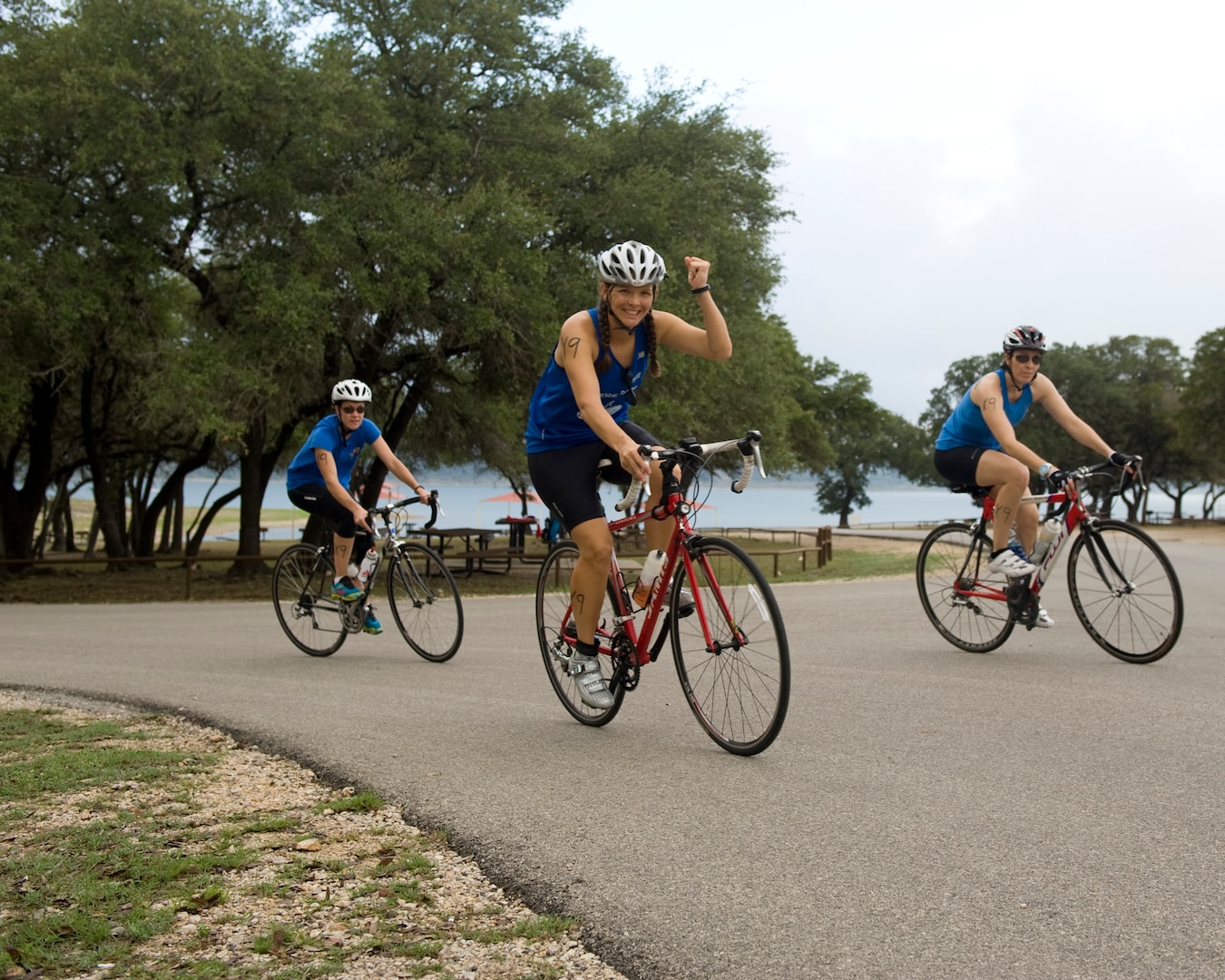 Relay teams stay motivated and power through the 22-mile biking portion of the Rambler 120 Adventure Race at Joint Base San Antonio Recreation Part Sept. 20, 2014. The rigorous route, throughout Canyon Lake, tests participant’s endurance and strength. (U.S. Air Force photo by Airman Justine K. Rho/released) 