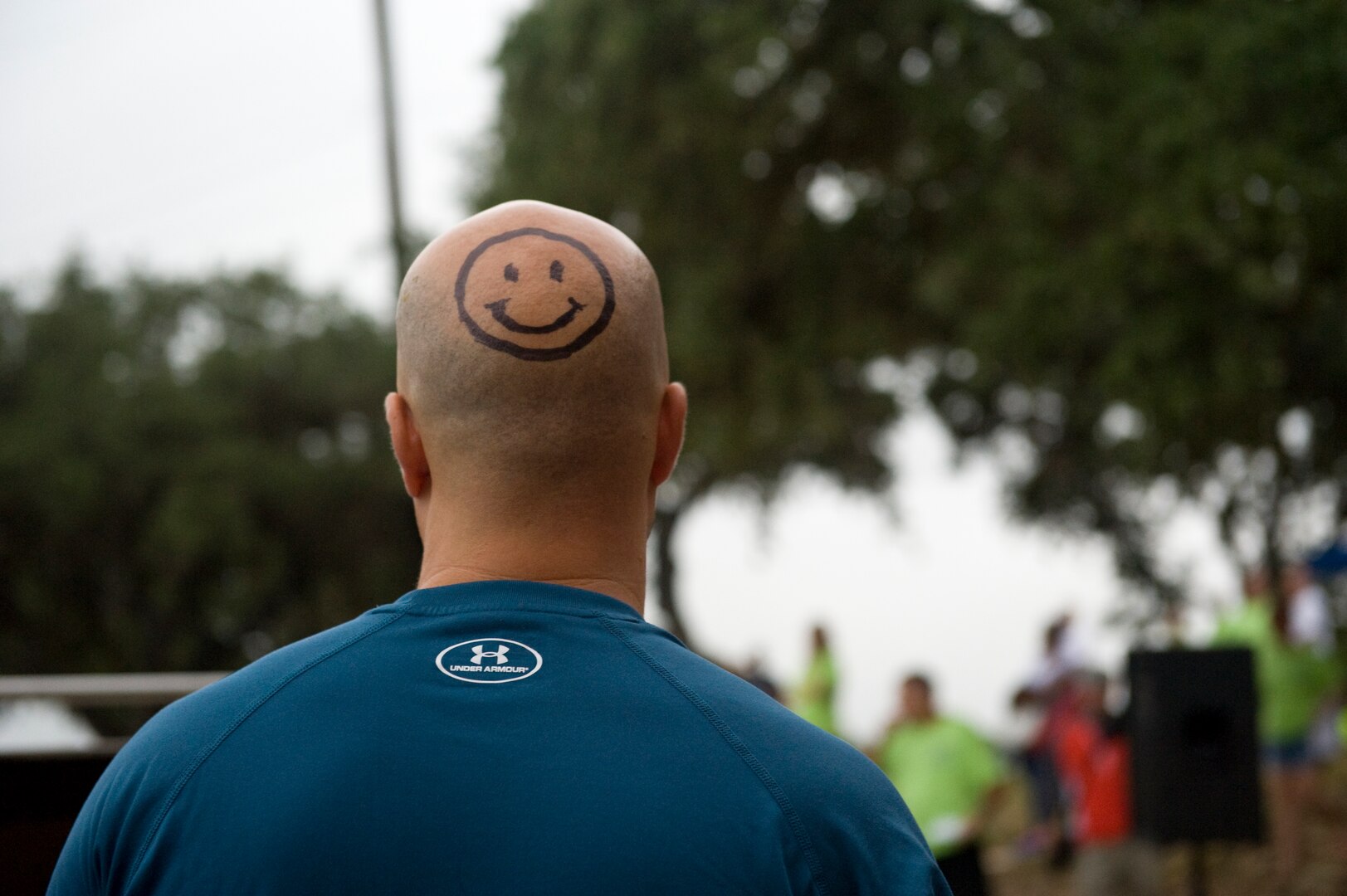 Spirits are high during the morning briefings, Sept. 20, 2014, at the Rambler 120 Adventure Race at Joint Base San Antonio Recreation Park at Canyon Lake. Participants must demonstrate teamwork and perseverance to complete the 22-mile bike ride, six-mile run and two-mile raft race. Positive encouragement from family, friends and teammates keeps participants motivated and smiling. (U.S. Air Force photo by Airman Justine K. Rho) 