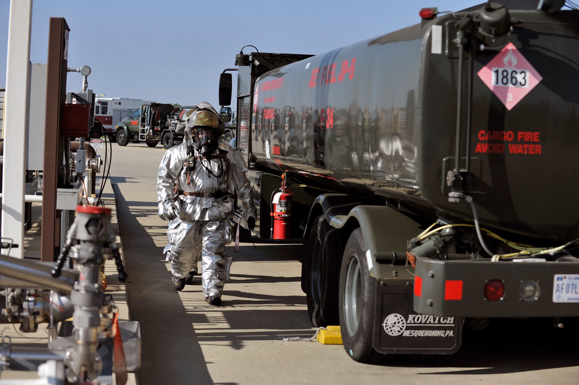 William Johnson, 375th Civil Engineering Squadron station captain, and Staff Sgt. Eric Butler, firefighter, investigate a simulated fuel spill at Scott Air Force Base, Ill., Sept. 25, 2014. The 126th Air National Guard’s fuel tanks had a simulated leaking valve. Under a ticking clock, 375 CES, bioenvironmental, security forces, and other base resources converged to quickly mitigate the problem. The Wing Inspection Team observed the actions of the participating players and suggested the players went through the scenario just as they would do in real life to get the most out of the exercise. (U.S. Air Force photo by Airman 1st Class Erica Crossen)