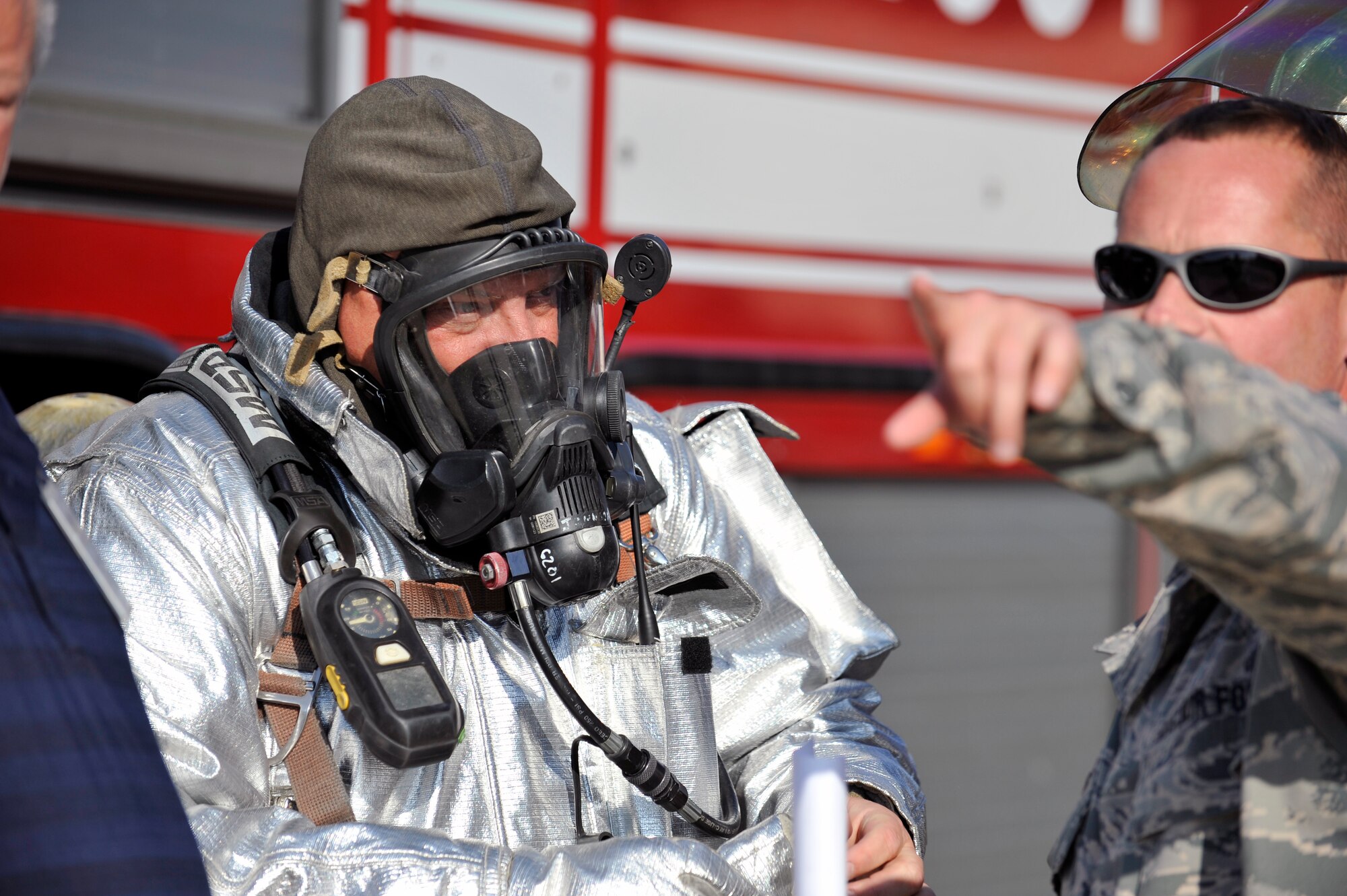 William Johnson, 375th Civil Engineering Squadron fire station captain, and Tech. Sgt. Keith McPherson, 126th Logistics Readiness Squadron’s Petroleum, Oils, and Lubricants technician, work out a strategy during a simulated fuel spill at Scott Air Force Base, Illinois, Sept. 25, 2014. The 126th Air National Guard’s fuel tanks were the focus of the exercise, with a simulated leaking fuel valve. Under a ticking clock, 375 CES, bioenvironmental, security forces, and other base resources converged to quickly mitigate the problem. The Wing Inspection Team observed the actions of the participating players and suggested efficient ways to utilize different organizations. (U.S. Air Force photo by Airman 1st Class Erica Crossen)