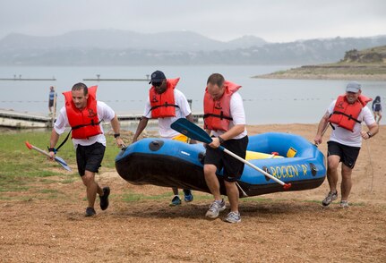 Mike Granberry, Troy Palmer, John Scott and David Drichta participate in the Rambler 120 Race, which includes running, biking, rafting and a mystery event, was held at Joint Base San Antonio Recreation Park at Canyon Lake Sept. 20.  Twenty-nine teams competed in the 22-mile bike course, 6-mile run 2-mile rafting event and the frisbee golf mystery event. (U.S. Air Force photo by Joshua Rodriguez) (released)