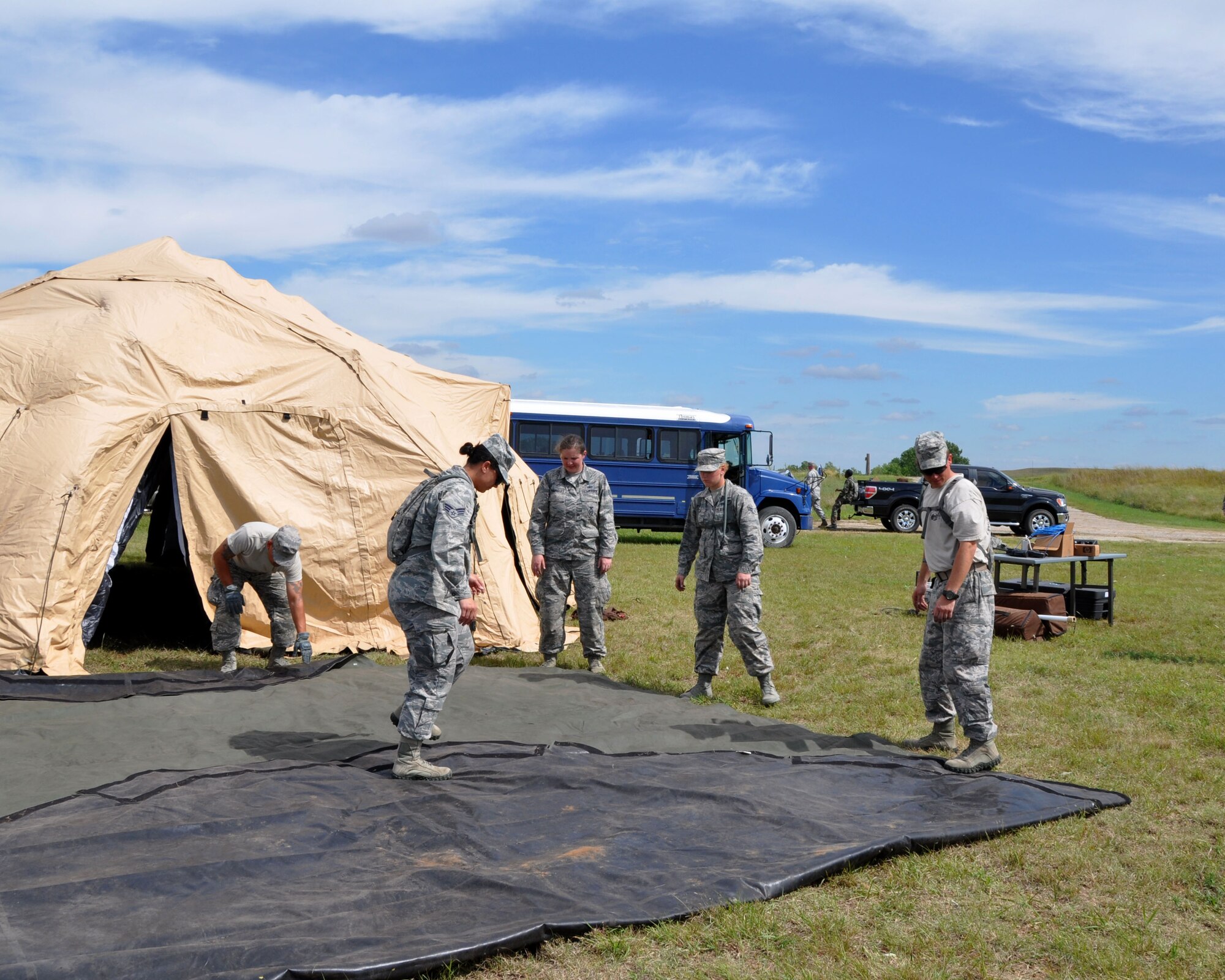 Members of the 931st Security Forces Squadron assemble a tent as part of a training scenario at Smoky Hill Training Site on Sept. 7, 2014, Salina, Kan. More than 30 members of the 931st SFS participated in the training, as part of an annual Air Force requirement.  (U.S. Air Force photo by Maj. Martha Kuder)