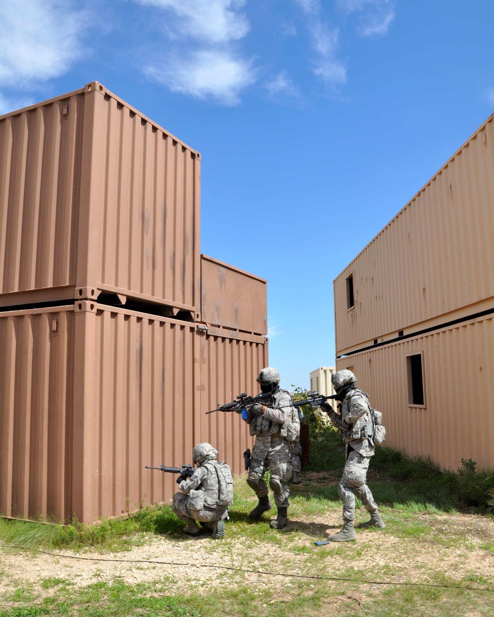 Members of the 931st Security Forces Squadron maneuver as a team during a training scenario at Smoky Hill Training Site on Sept. 7, 2014, Salina, Kan. More than 30 members of the 931st SFS participated in the training, as part of an annual Air Force requirement.  (U.S. Air Force photo by Maj. Martha Kuder)