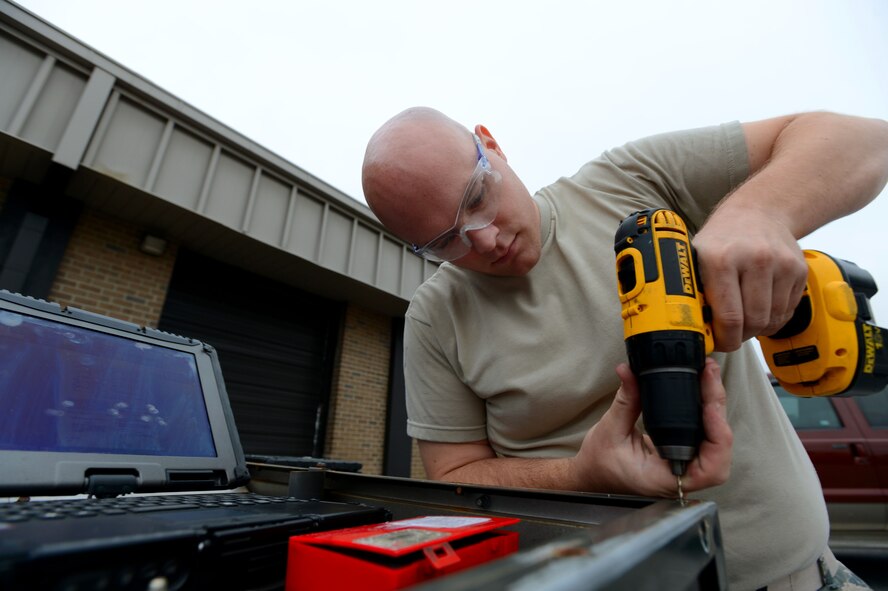 U.S. Air Force Staff Sgt. Joseph Shelton, 20th Equipment Maintenance Squadron aircraft structural maintenance craftsman, drills a hole in a CB-DH43 heater at Shaw Air Force Base, S.C., Sept. 26, 2014. Shelton, an Ashville, N.C. native, installed new hardware on the heater after being informed the broken piece was unable to be welded. (U.S. Air Force photo by Airman 1st Class Jensen Stidham/Released) 