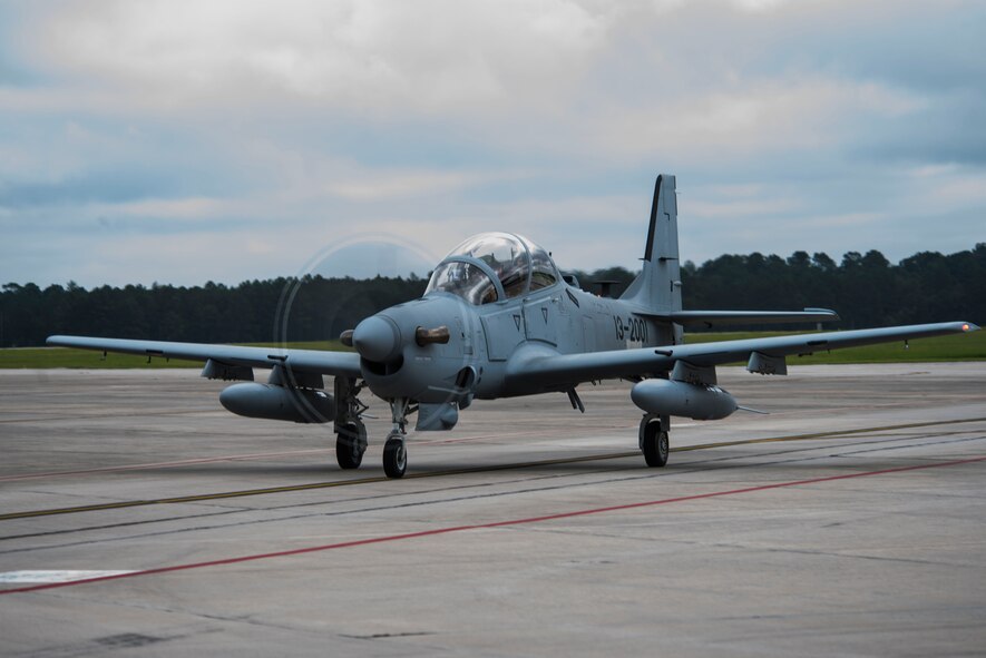 Chris Carlson, Sierra Nevada Corporation senior pilot, taxis an A-29 Super Tucano on the flightline during its first arrival at Moody Air Force Base, Ga., Sept. 26, 2014. The Afghan Air Force will implement the A-29 as their current air-to-ground aircraft, the Mi-35 attack helicopter, reaches its end of service life in January 2016.  (U.S. Air Force photo by Airman 1st Class Dillian Bamman/Released)