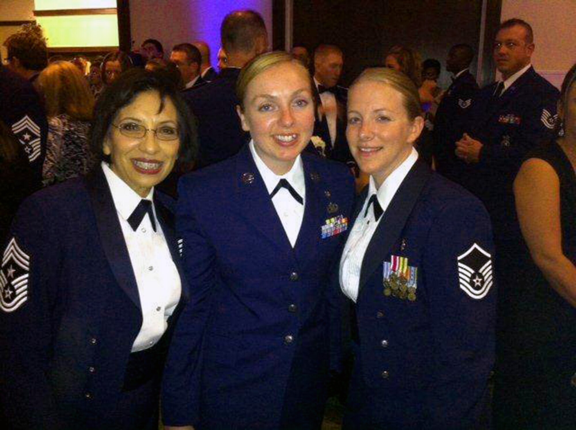 Chief Master Sgt. Ericka E. Kelly, 349th Air Mobility Wing Command Chief; Tech. Sgt. Nicole Nagle, 349th Aerospace Medicine Squadron; and Master Sgt. Latisha Meledez, 349th Medical Squadron, celebrate the Air Force's 67th birthday at the Air Force Ball Sept. 12, 2014 at Travis Air Force Base, Calif. (Courtesy photo)