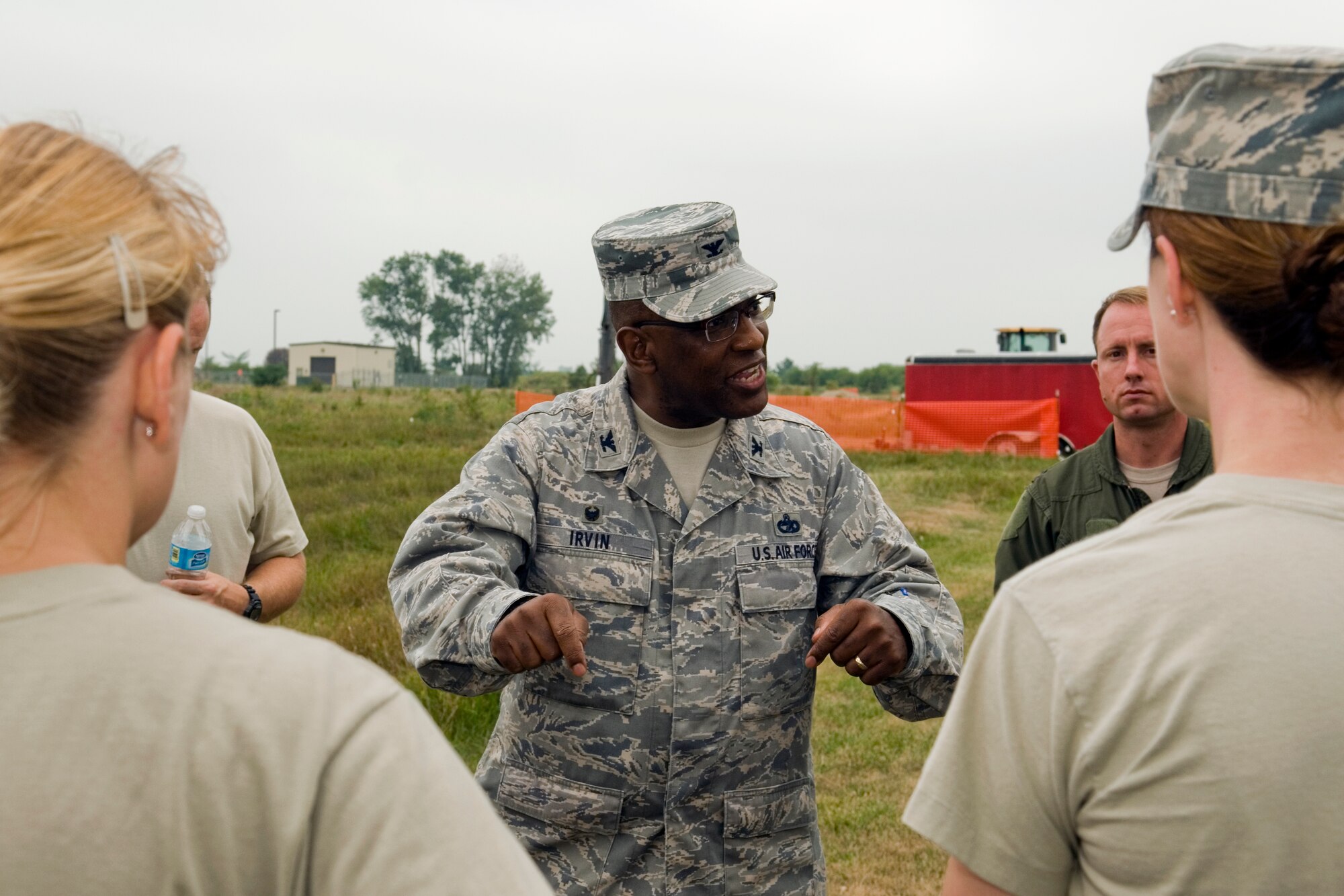 Col. Marshall Irvin, 94th Mission Support Group commander,gives feedback to junior officers during a Junior Officer Leadership Development Course field training exercise at Grissom Air Reserve Base, Ind., Aug. 16, 2014. The field training exercise is used to test the student's ability to integrate the leadership skills taught during the JOLD course with hands-on, teambuilding exercises similar to those that could be encountered during real-world scenarios. (U.S. Air Force photo/Staff Sgt. Ben Mota)  