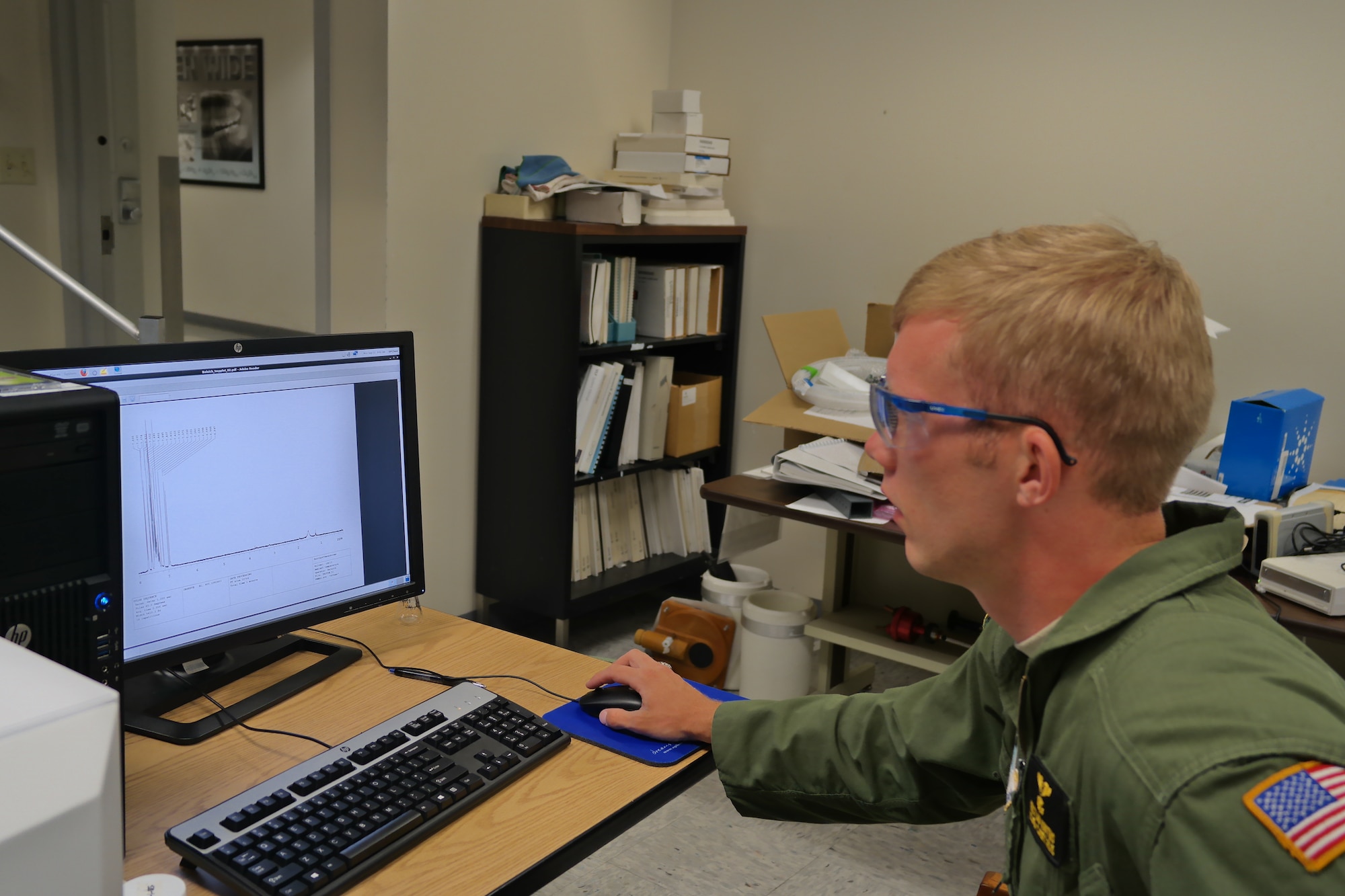 Cadet 1st Class Kristian Knuths tests a polymer sample in the Academy's chemistry laboratory. Knuth is working with local company CTI Inks as part of his independent study course. (U.S. Air Force photo)