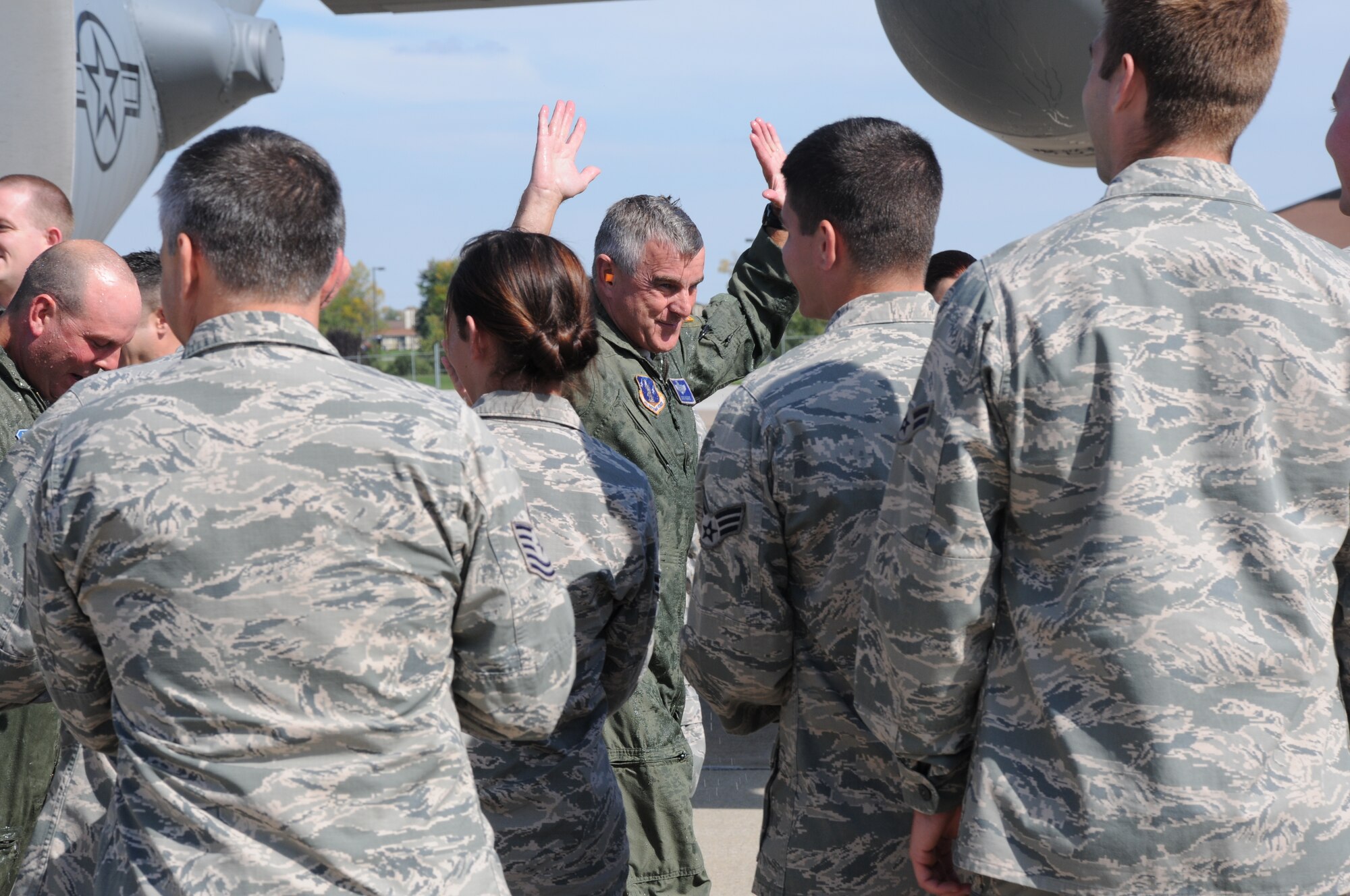 107th Airlift Wing Commander Col. John Higgins steps off the final C-130 flight of the 107th Airlift Wing here, at the Niagara Falls Air Reserve Station, N.Y. September 25, 2014. As a consequence of a more recent force structure announcement, it was decided the 107th would cease flying C-130s, no longer be associated with the Reserve and will transition to their new mission flying Remotely Piloted Aircraft. (U.S. Air Force photo by Staff Sgt. Matthew Burke) 