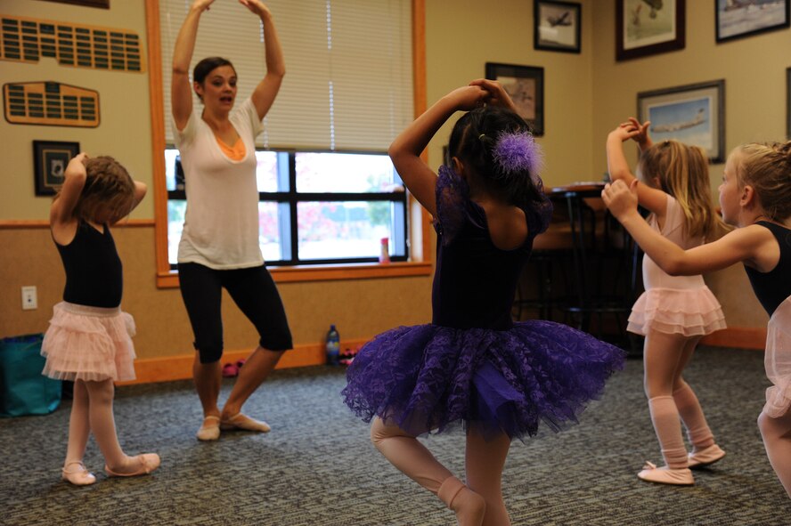 Heather Dayton, dance instructor, teaches beginning ballet to children of Malmstrom Air Force Base, Mont., at the Grizzly Bend Sept. 22.  The Bend is now offering classes every Monday for children ages 18 months to 18 years old through December. (U.S. Air Force photo/Staff Sgt. Lindsey Soulsby)