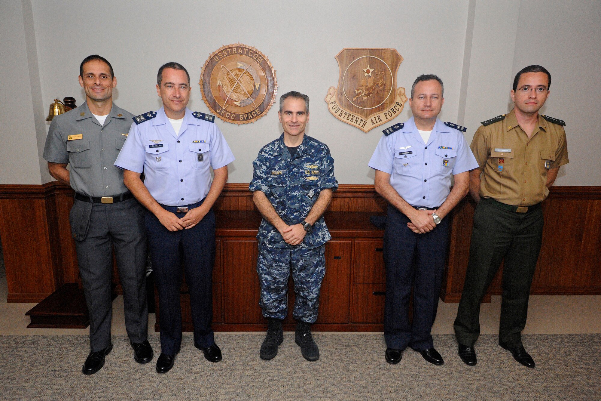U.S. Navy Rdml. Brian B. Brown, deputy commander, Joint Force Component Command (JFCC) Space, poses with members of the Brazilian Air Force during a visit to the JFCC headquarters building, Vandenberg Air Force Base, Calif., Sep. 15, 2014.  The Brazilian Air Force officers met with numerous subject matter experts to obtain best practices as they work to establish their first military space operations center.  (U.S. Air Force photo by Airman Robert Volio/Released)