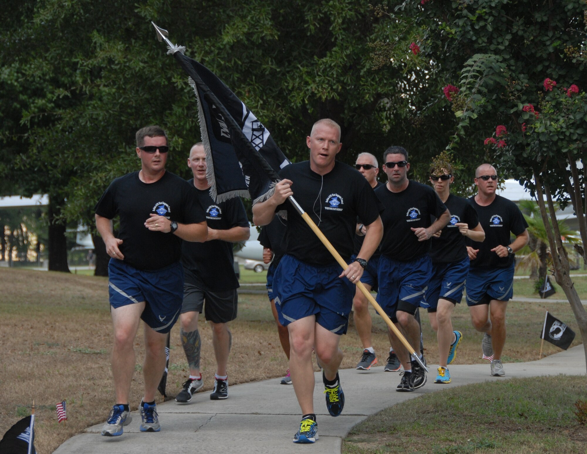 First Sergeants keep the flag moving during the 24- hour vigil run in recognition of America's POW/MIA's outside the Museum of Aviation Sept. 17. The run led into the official POW/MIA ceremony held the following day. (U.S. Air Force photo by Misuzu Allen)