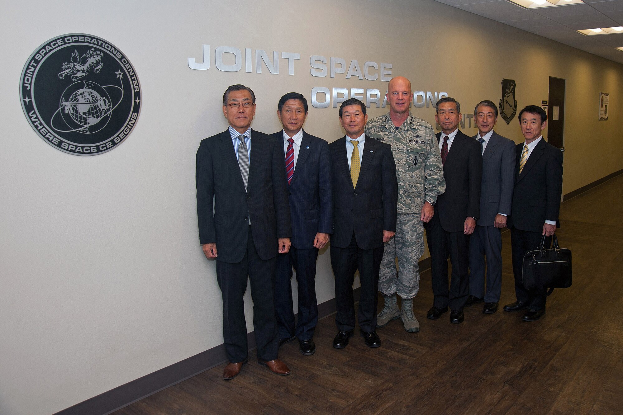 U.S. Air Force Lt. Gen. John W. Raymond, commander, 14th Air Force and Joint Functional Component Command (JFCC) for Space, stands with retired Japan Self-Defense Force (JSDF) generals after touring the Joint Space Operations Center (JSpOC) located at Vandenberg Air Force Base, Calif., during a Japan America Air Force Goodwill Association (JAAGA) visit, Sep. 12, 2014.  The JAAGA delegation serves in an advisory capacity to current U.S. and Japanese military leadership and visited the JSpOC in an effort to bolster existing partnerships in Space Situational Awareness (SSA). (U.S. Air Force Photo by Michael Peterson/Released)